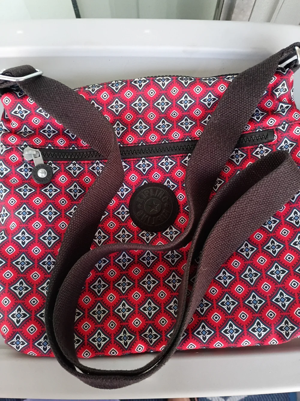 Kipling Jaime crossbody shoulder bag in the red mystical medallion